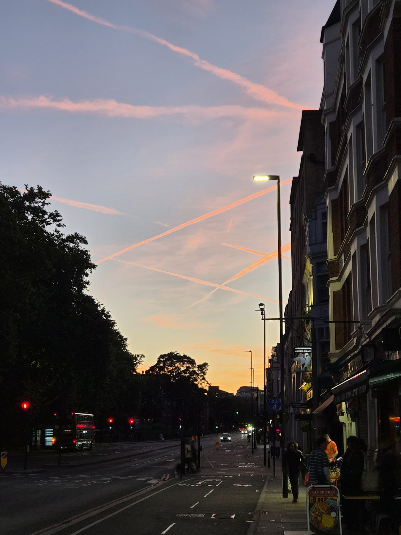 Contrails going pink over the White Swan.